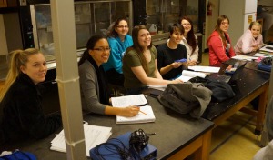 The student group studying the osteostracan (jawless fish), _Hemicyclaspis_.